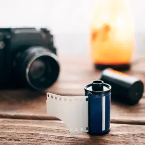 Close-up Reel of photographic film on a wooden table.