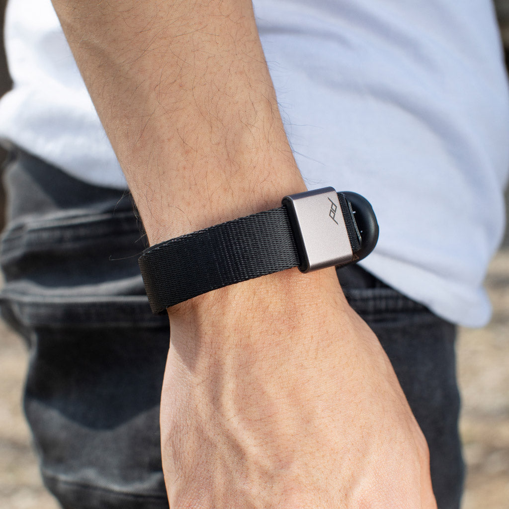 Wearing black cuff as bracelet while the adjustable magnet holds the loose end of Cuff Wearing black cuff as bracelet while the adjustable magnet holds the loose end of Cuff